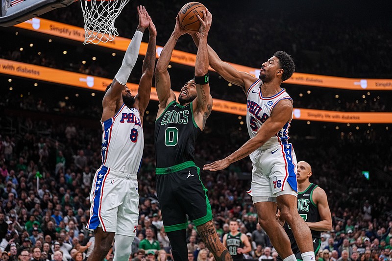 Apr 28, 2026; Boston, Massachusetts, USA; Philadelphia 76ers guard Quentin Grimes (5) and forward Paul George (8) defend against Boston Celtics forward Jayson Tatum (0) in the second half during game five of the first round of the 2026 NBA Playoffs at TD Garden. Mandatory Credit: David Butler II-Imagn Images
