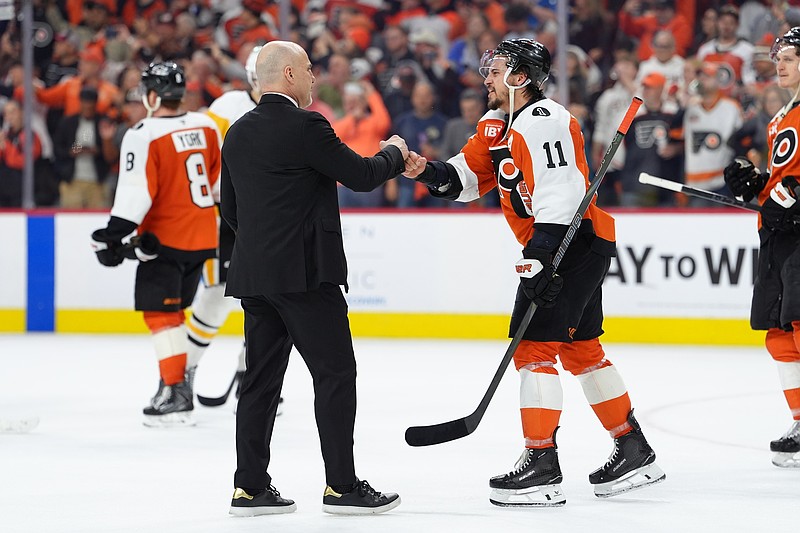 Apr 29, 2026; Philadelphia, Pennsylvania, USA; Philadelphia Flyers head coach Rick Tocchet reacts with right wing Travis Konecny (11) after game six of the first round of the 2026 Stanley Cup Playoffs against the Pittsburgh Penguins at Xfinity Mobile Arena. Mandatory Credit: Kyle Ross-Imagn Images