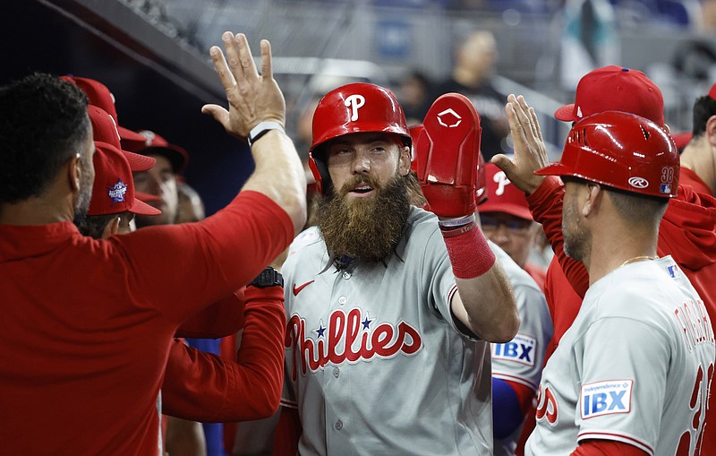 May 1,  2026; Miami, Florida, USA;  Philadelphia Phillies center fielder Brandon Marsh (16) celebrates scoring with teammates against the Miami Marlins during the seventh inning loanDepot Park. Mandatory Credit: Rhona Wise-Imagn Images