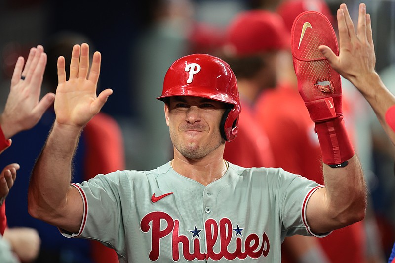 Sep 5, 2025; Miami, Florida, USA; Philadelphia Phillies catcher J.T. Realmuto (10) celebrates after scoring against the Miami Marlins during the fourth inning at loanDepot Park. Mandatory Credit: Sam Navarro-Imagn Images