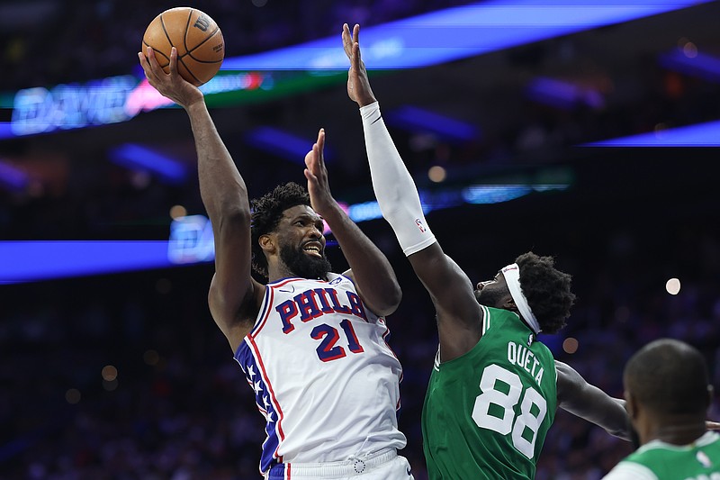 Apr 30, 2026; Philadelphia, Pennsylvania, USA; Philadelphia 76ers center Joel Embiid (21) drives for a shot against Boston Celtics center Neemias Queta (88) during the third quarter at Xfinity Mobile Arena. Mandatory Credit: Bill Streicher-Imagn Images