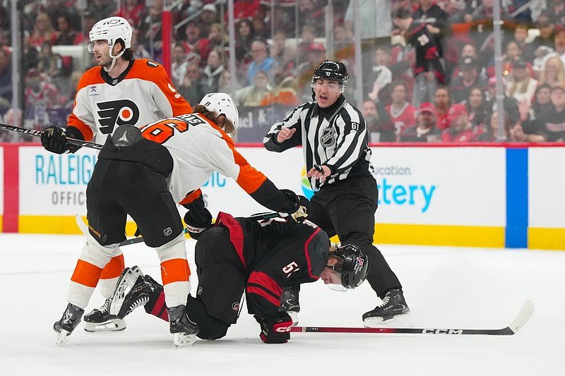 May 2, 2026; Raleigh, North Carolina, USA; Carolina Hurricanes right wing Jackson Blake (53) is cross checked by Philadelphia Flyers center Trevor Zegras (46) during the third period Lenovo Center. Mandatory Credit: James Guillory-Imagn Images