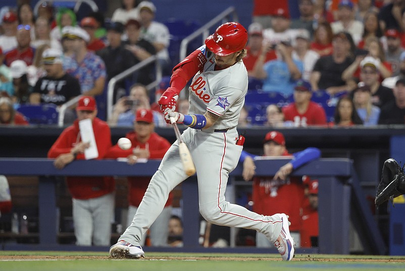 May 3, 2026; Miami, Florida, USA;  Philadelphia Phillies second baseman Bryson Stott (5) hits a home run against the Miami Marlins during the first inning at loanDepot Park. Mandatory Credit: Rhona Wise-Imagn Images