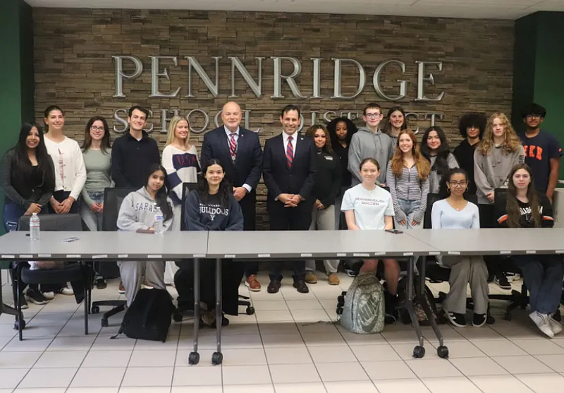 Bucks County District Attorney Joe Khan poses for a picture with the Pennridge High School pre-law club and Superintendent Dr. Angelo Berrios