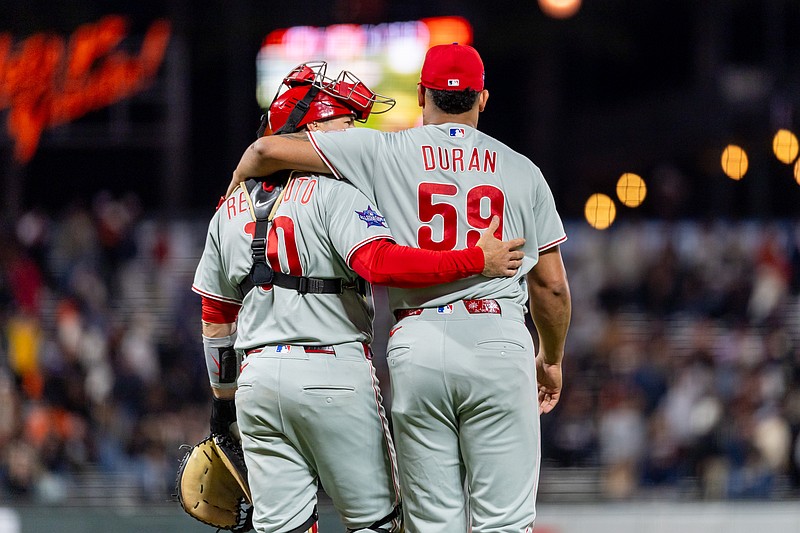 Apr 6, 2026; San Francisco, California, USA; Philadelphia Phillies catcher J.T. Realmuto (10) and Philadelphia Phillies pitcher Jhoan Duran (59) celebrate their victory against the San Francisco Giants at Oracle Park. Mandatory Credit: Bob Kupbens-Imagn Images