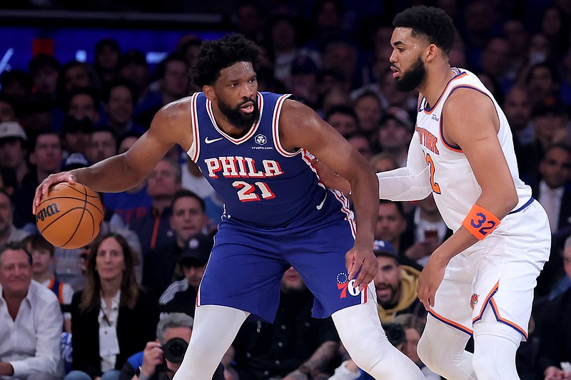 May 4, 2026; New York, New York, USA; Philadelphia 76ers center Joel Embiid (21) controls the ball against New York Knicks center Karl-Anthony Towns (32) during the first quarter of game one of the eastern conference semifinal round of the 2026 NBA Playoffs at Madison Square Garden. Mandatory Credit: Brad Penner-Imagn Images