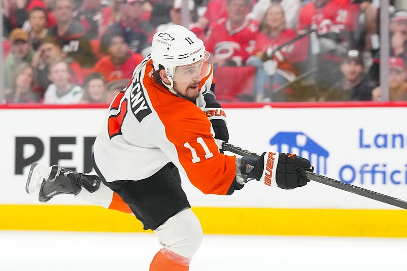 May 4, 2026; Raleigh, North Carolina, USA; Philadelphia Flyers right wing Travis Konecny (11) takes a shot against the Carolina Hurricanes in the first overtime in game two of the second round of the 2026 Stanley Cup Playoffs at Lenovo Center. Mandatory Credit: James Guillory-Imagn Images