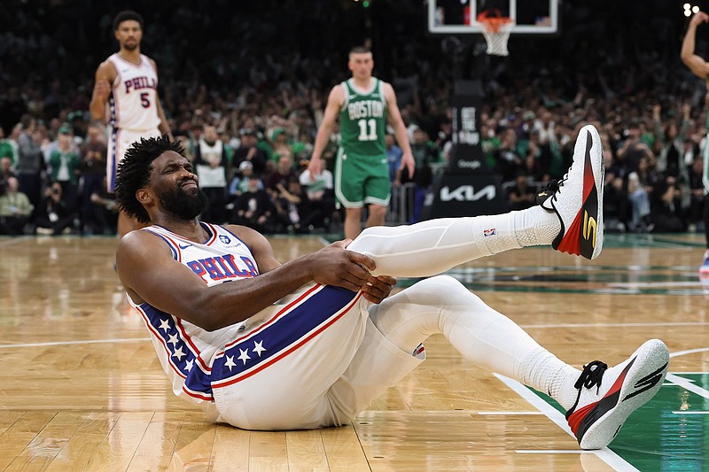 May 2, 2026; Boston, Massachusetts, USA; Philadelphia 76ers center Joel Embiid (21) grabs his leg after going down during the second half of game seven of the first round of the 2026 NBA Playoffs against the Boston Celtics at TD Garden. Mandatory Credit: Winslow Townson-Imagn Images