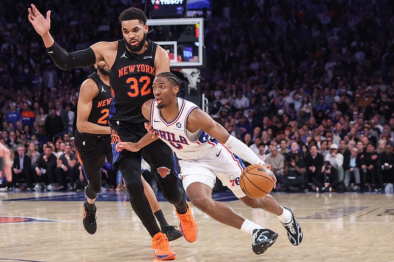 May 6, 2026; New York, New York, USA; Philadelphia 76ers guard Tyrese Maxey (0) drives past New York Knicks center Karl-Anthony Towns (32) during game five of the second round of the 2026 NBA Playoffs at Madison Square Garden. Mandatory Credit: Wendell Cruz-Imagn Images