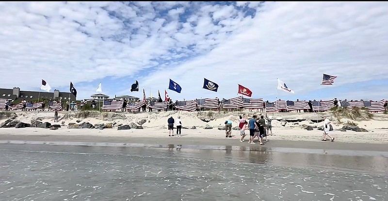 During the Flags of Liberty ceremony, participants will line the Boardwalk to honor their loved ones by holding up a chain of unfurled American flags in remembrance. (Photos courtesy of Greater Wildwoods Tourism Improvement and Development Authority)