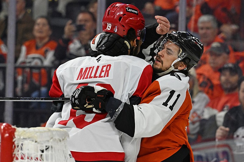 May 7, 2026; Philadelphia, Pennsylvania, USA; Philadelphia Flyers right wing Travis Konecny (11) battles wit Carolina Hurricanes defenseman K'andre Miller (19) during the third period in game three of the second round of the 2026 Stanley Cup Playoffs at Xfinity Mobile Arena. Mandatory Credit: Eric Hartline-Imagn Images