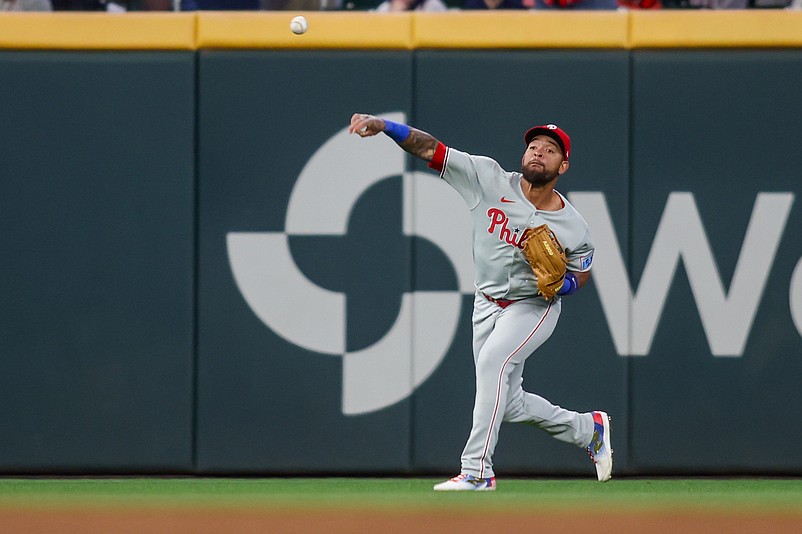 Apr 8, 2025; Atlanta, Georgia, USA; Philadelphia Phillies shortstop Edmundo Sosa (33) throws the ball against the Atlanta Braves in the sixth inning at Truist Park. Mandatory Credit: Brett Davis-Imagn Images