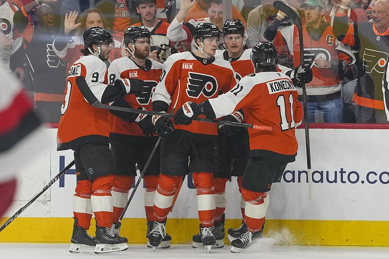 May 9, 2026; Philadelphia, Pennsylvania, USA; Philadelphia Flyers left wing Alex Bump (20) celebrates a goal teammates against the Carolina Hurricanes in game four of the second round of the 2026 Stanely Cup Playoffs at Xfinity Mobile Arena. Mandatory Credit: James Lang-Imagn Images