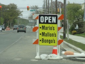 Signs let motorists know about businesses that remain open during a road construction project on Bay Avenue in Ocean City, NJ.