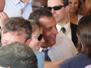 Gov. Chris Christie poses for photographs in a long walk across the Ocean City Boardwalk on Thursday.