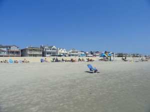 A view from the water shows a terraced wrack line, "towel area" and protective berm.