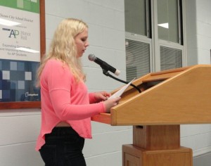 Casey Rosamond reads anonymous testimonials from students who say they were bullied in the Ocean City School District.