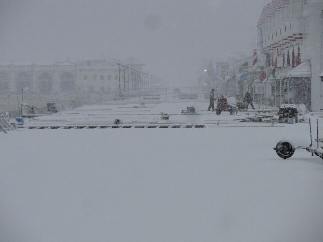 The weather doesn't stop workers from pushing to complete a boardwalk reconstruction project at Sixth Street.