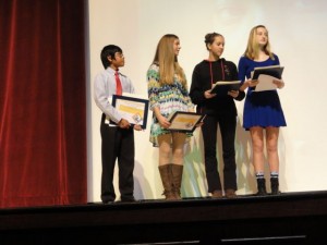 Jared Warrington, Emily DiMarino, Andrea Teofanova and Ava Auwarter read from their winning entries in an Ocean City Intermediate School essay contest.