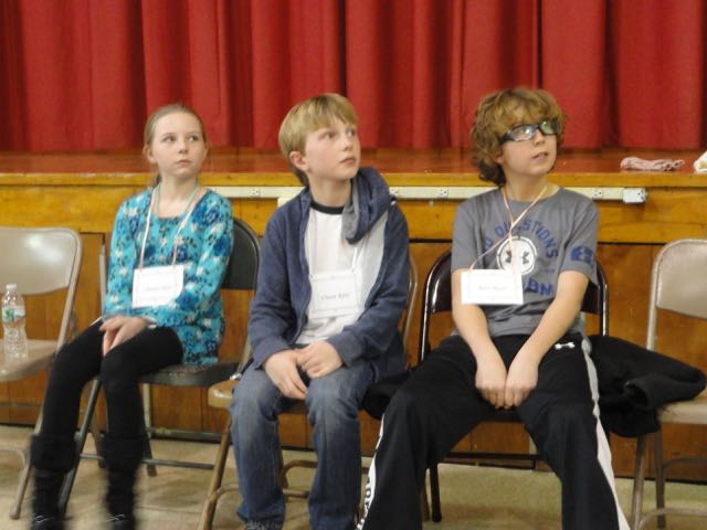 Chanon Styer, Owen Ritti and Race Myer listen to instructions before the final round of a spelling bee Thursday at Ocean City Intermediate School. They will represent Ocean City in district competition.