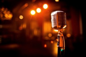 Retro microphone on stage in restaurant. Blurred background