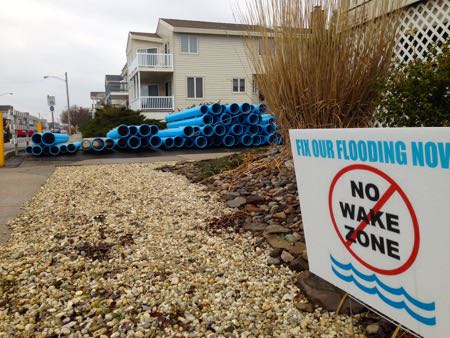 A property displays a new 'No Wake Zone' sign near the intersection of 32nd Street and Haven Avenue in Ocean City, NJ, where some road work is about to begin.