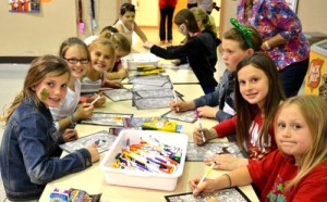 Third graders Bria Condella, Reagan DeVlieger, Mia Gallagher, Ella Quintin, Anna Stamm, Lola Bourgeois, Schyler MacMichael and Ava Pitman enjoying crafts at the recent OCPS fiesta.