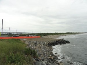 A new rock berm protect a parking lot that was damaged by Superstorm Sandy in October 2012 and repaired last week.