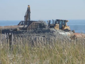 Sand and mud fly at North Street Beach on Tuesday morning (Nov. 3) as the north end beach replenishment project kicks into high gear in Ocean City, NJ. 