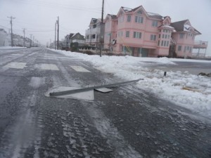 Wind flattens a street sign on Central Avenue at the south end on Saturday.