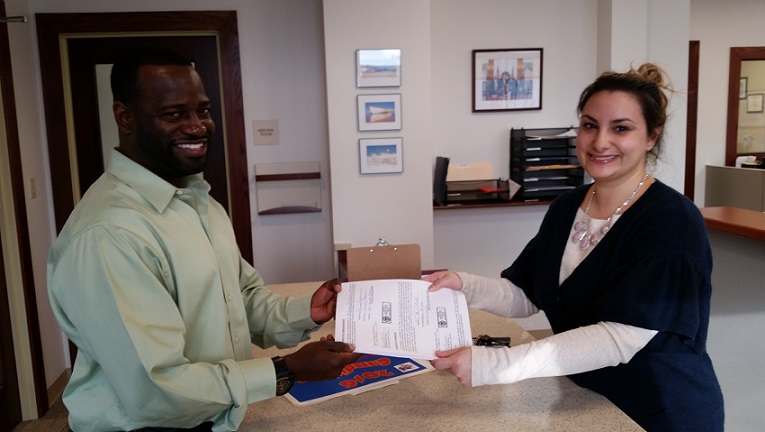 Antwan McClellan turns in his nominating petitions to City Clerk Melissa Bovera.5