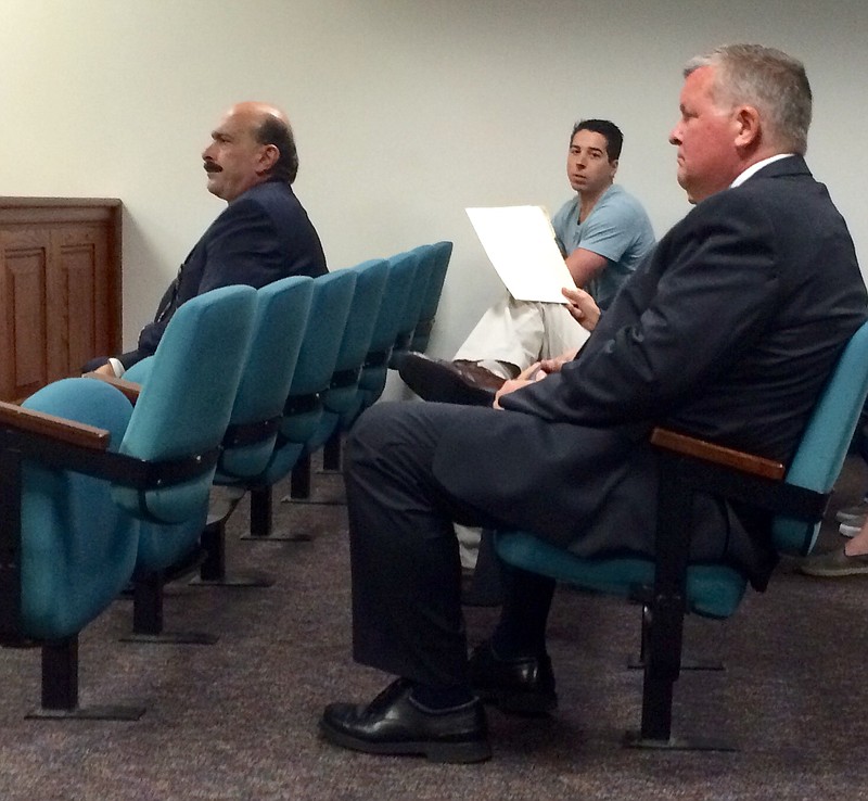 Charles E. "Chuck" Cusack, right, is shown in criminal court in March 2016 during his sentence for sexual misconduct.