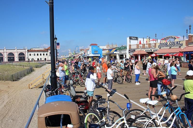 A large crowd of onlookers stopped for the flag-raising