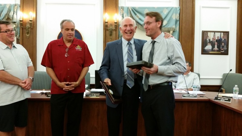 Mayor Jay Gillian, right, who presented Guinosso with an honorary piece of the Boardwalk, told him, 