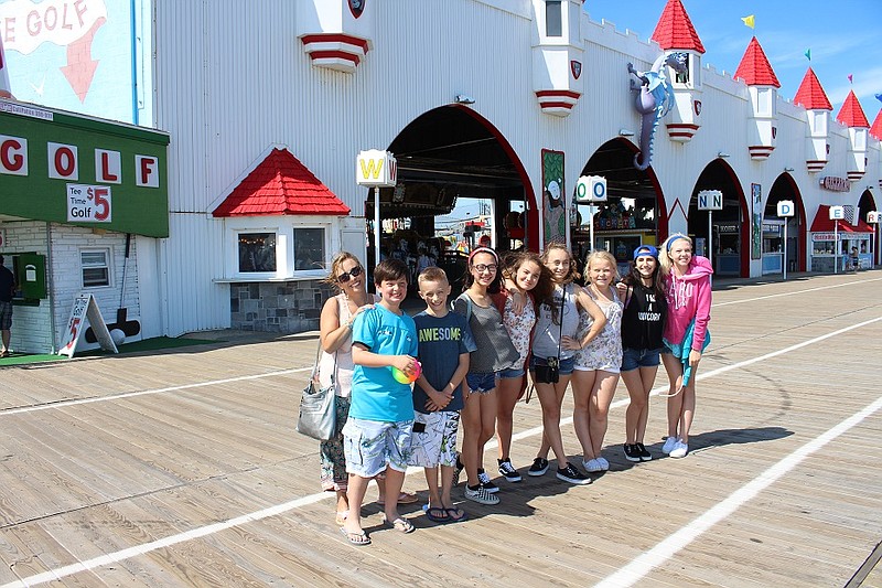 Leslie Hammer (far left) brought a group of youngsters to the Boardwalk on Friday.  From left are Nick, JP, Kaylyn, Sarah, Julia, Jac, Sarah and Maddie