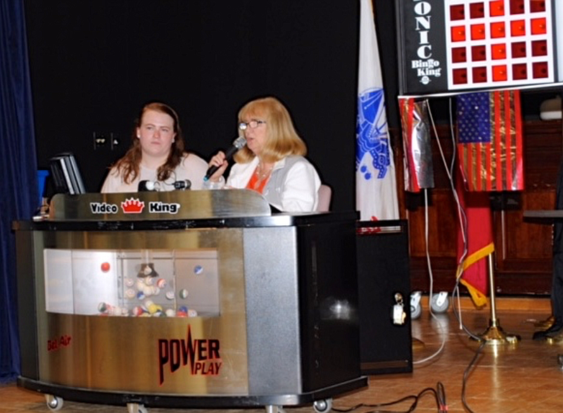 Auxiliary Member Nancy Plaushinat (right) calls numbers at the                            Vineland Veterans Home.