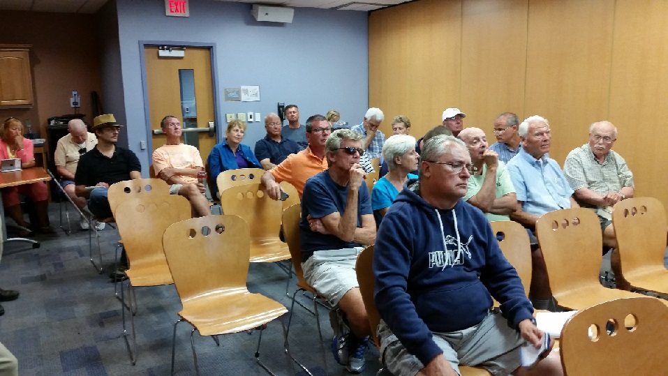 The audience listens to plans for the 34th Street Bridge's redecking during a public hearing.