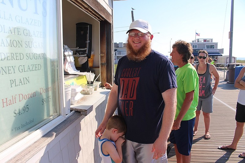 Jonathan Tanis and three-year-old Noah, of Easton, PA,  wait for donuts at Brown's Restaurant.