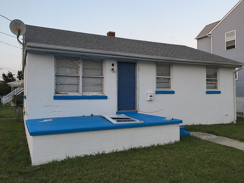 Several on hand suggested that properties like this neglected one, be acquired and be re-developed instead of using green space.