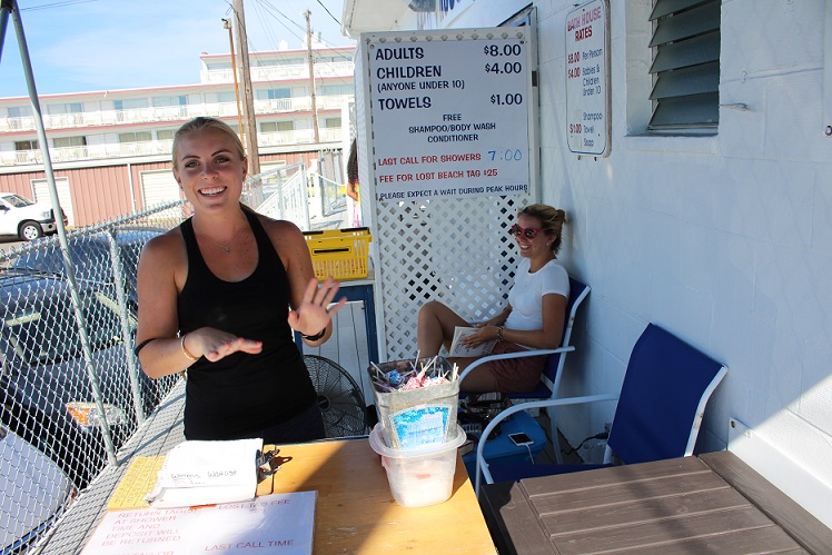 Bath House cashier Courtney Smith (foreground) and bath house attendant Maddie Barbieri at the 13th St. Bath House. 