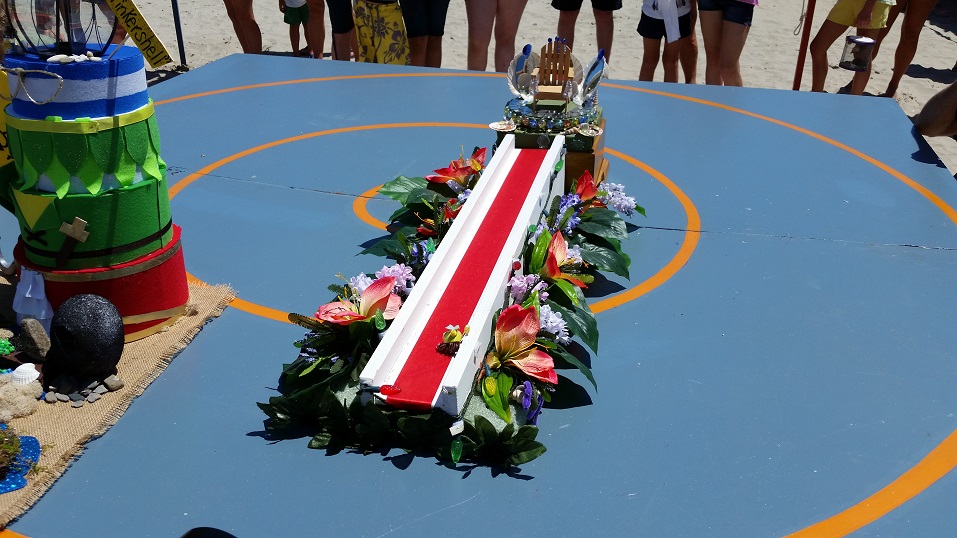 The winning crab crawls down a flower-adorned miniature runway while being serenaded by the pageant's official theme song, 