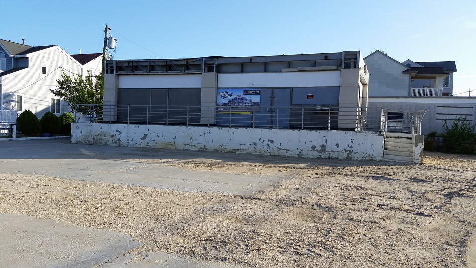 The crumbling former Exxon gasoline station is one property that the city will consider acquiring and turning into open space as part of plans to spruce up the Ninth Street gateway.