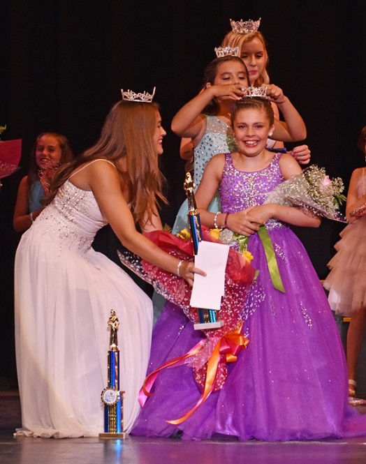 Little Miss Ocean City 2016 Sarah Rodriguez crowns her successor, Charlotte Erickson, as Little Miss Ocean City 2017 Saturday night at the Ocean City Music Pier. At left is Junior Miss Ocean City Paige Aita. Photo Credit: David Nahan/Ocean City Sentinel - Thank you