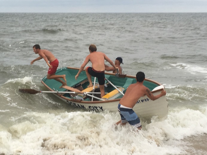 Eddie Keenan jumps out of boat at end of the middle leg of the three-team doubles relay. Partner Jackson Kirk right behind. Photo Credit: Ed Keenan