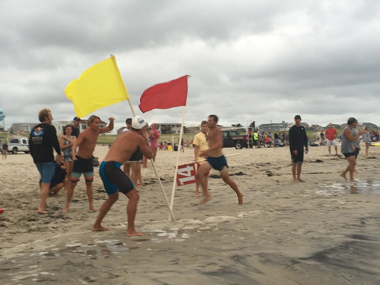 Keenan runs first leg (half mile) of Iron Man Relay tagging Cassidy with a ten second lead into the ocean, which Cassidy added an additional ten seconds onto during his swim.