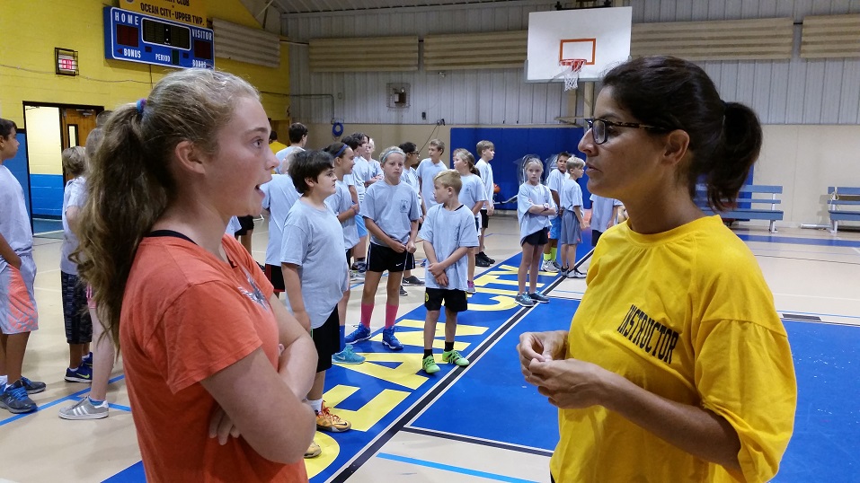 Alexia Schmidt, 14, of Upper Township, who comes from a police family and wants to become a K-9 officer, talks with Officer Jennifer Elias.