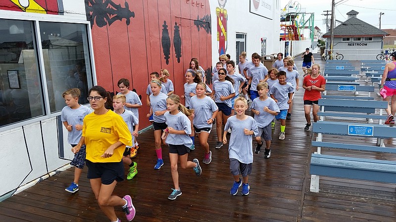 The recruits head out for a jog Thursday morning on the Boardwalk.