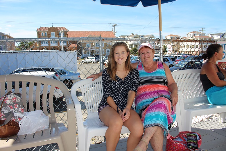 Susan Blevins and granddaughter Sedona, who took a bus to Ocean City from Lancaster, Pa., relax after showering.