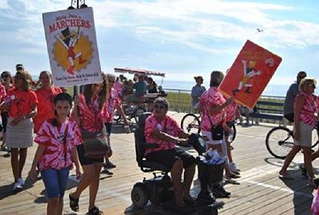 Walkers in team t-shirts with personal stories and connections to ALS