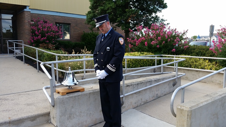 Fire Capt. Gary Green solemnly tapped a silver bell during an old firefighting tradition that honored the 9/11 victims.